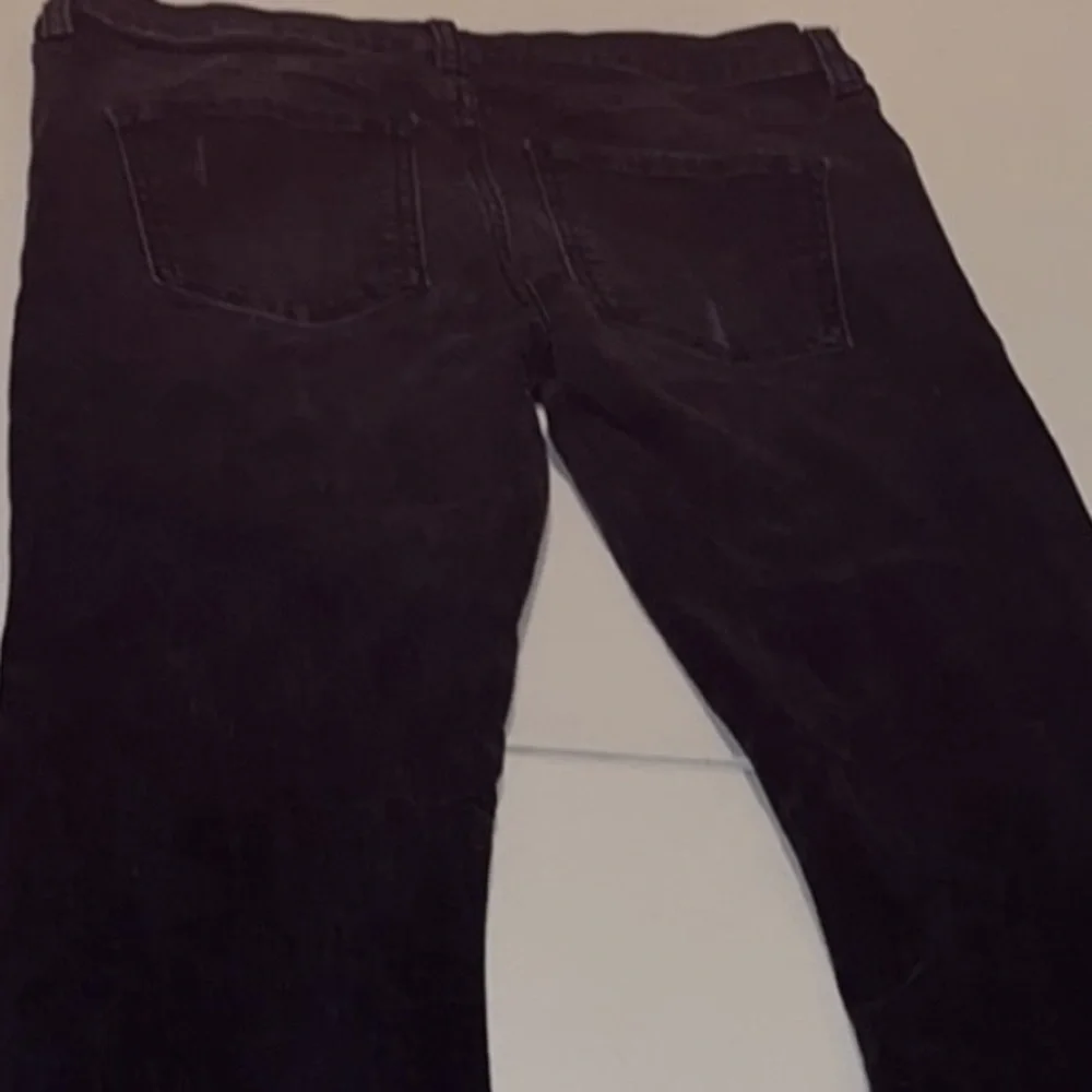 Free People size 27 Black Wash skinny jeans distressed with raw hem